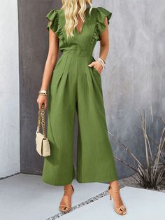 Unleash your inner fashion icon with the All Time Classic Wide Pants Jumpsuit. This classic and timeless piece features wide leg pants that provide comfort and effortless style. Perfect for any occasion, this jumpsuit is a staple in any wardrobe. Upgrade your fashion game today! Size Guide: Model is 5’85” tall, and has a 34.1” bust, 24.2” waist, & 35.7” hips. She is wearing a S / US 4 / AU 8. This jumpsuit is true to size. Material: 95% Polyester, 5% Elastane Feature: V-Neckline. Ruffle shoulder. Wide leg. Not lined. Back button closure. Relaxed fit. Care Instructions: Machine wash / Cold hand wash Chic Solid Overalls With Pockets, Non-stretch Wide Leg Jumpsuits And Rompers For Summer, Chic Overalls With Pockets, Elegant Wide Leg Jumpsuits And Rompers With Pockets, Chic Full-length Jumpsuits And Rompers With Pockets, Chic Wide Leg Overalls For Spring, Casual Full-length Jumpsuits And Rompers For Spring, Non-stretch Wide Leg Jumpsuits And Rompers, Chic Spring Wide-leg Overalls