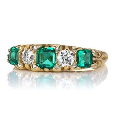 an emerald and diamond five stone ring, by van cleef in yellow gold