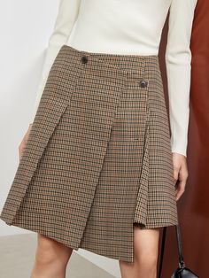 MO&Co. Women's Asymmetric Vintage Check Skirt Features : - Houndstooth plaid elements - Skirt with double buttonholes - Wide pressed pleated designCode: MBB3SKTT08The length of size M is 47.5cmBrown: Model is 176cm tall and wearing a size M MATERIALS & CARE : Material: 100% PolyesterDo not wash, do not bleach Hang to dry, tumble dry Iron at low temperature, professional dry cleaning Do not expose to the sunPlease select your own size in the size chart according to your figure and serve model siz Fall Workwear Knee-length Skort, Fall Office Skirted Bottoms, Asymmetrical Skirt With Buttons For Workwear, Fall Workwear Pleated Skort, Fall Workwear Skort With Pleated Hem, Plaid Pleated Short Skort, Pleated Hem Skort For Workwear In Fall, Fall Pleated Skort For Workwear, Fall Pleated Mini Skirt For Office