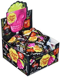 a skull shaped candy box filled with gummy skulls