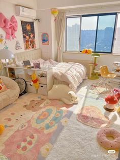 a child's bedroom decorated in pastel colors with toys and accessories on the floor