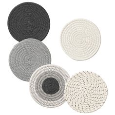 four round rugs in various colors and sizes