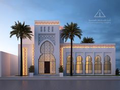 a large white building with palm trees and lights on the front door is lit up at night