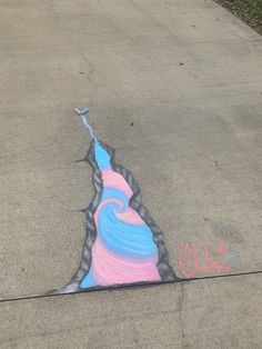 the sidewalk has been painted with chalk and pastel