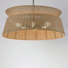 a rattan chandelier hanging from a ceiling