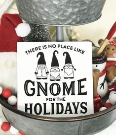 there is no place like gnomes for the holidays sign in front of christmas decorations