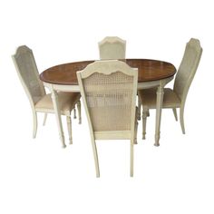 a dining room table with chairs and a round wooden table on top of the table