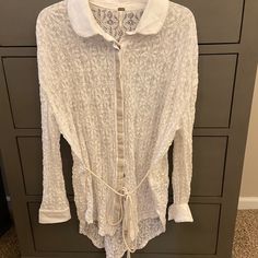 White Lacy, Long-Sleeved Free People Top With Cute Belt Detail. Size Medium, New With Tags. 23” Across, 27” Long. White Lace Tops For Fall, White Lace Top For Fall, White Lace Blouse For Layering, Off White Long Sleeve Tops For Loungewear, Casual Long Sleeve Lace Blouse, Long Sleeve Tops With Lace Trim For Daywear, Casual Off White Lace Tops, Lace Tops For Day Out In Fall, Casual Off-white Lace Tops