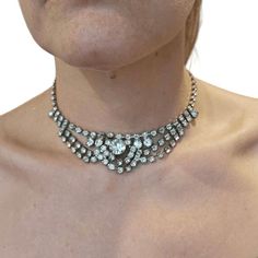 Approximately 14in long total Beautiful vintage conditionAll rhinestones in placenothing missing.  Great piece  Elevate your elegance with our exquisite Vintage 1970s Rhinestone Choker Necklace, a timeless piece that exudes sophistication and glamour. Crafted with meticulous attention to detail, this stunning choker features a dazzling array of sparkling rhinestones set in a delicate pattern, reminiscent of the opulent style of the 1970s.Indulge in the nostalgia of a bygone era while making a bold statement at any formal occasion. Whether you're attending a black-tie event, a romantic evening soirée, or a glamorous cocktail party, this vintage choker adds a touch of vintage charm and allure to your ensemble.The adjustable clasp ensures a comfortable fit, allowing you to wear this breathtak Party Bridal Necklace With 17 Jewels And Crystal, Formal Diamond Rhinestone Necklace, Formal Sparkling Diamond Rhinestone Necklace, Glamorous Rhinestone Necklaces For Anniversary, Glamorous Diamond Rhinestone Necklace For Formal Events, Glamorous Diamond Rhinestone Necklace For Formal Occasions, Formal Glamorous Sparkling Rhinestone Necklace, Glamorous Sparkling Rhinestone Necklace For Formal Events, Glamorous Sparkling Rhinestone Necklace For Formal Occasions