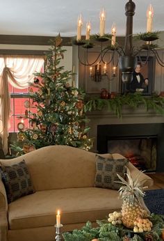 a living room filled with furniture and a christmas tree