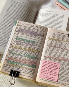 an open book with sticky notes attached to it