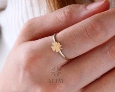 "ABOUT PRODUCT This 14K Yellow Gold Four Leaf Clover Ring is suitable gift for girlfriend, mom and her. You can even buy as a birthday gift for your friends or anniversary gifts, If you want to add a special note we can write for you and put to inside of package. We manufacture our jewelry pieces with carefully and after production we double checking in quality control department. Our main idea is keep our items for daily wearing especially for minimalist jewelry pieces. 14K Yellow Gold Four Lea White Engraved Ring As Fine Jewelry Gift, White Engraved Ring As Gift, White Engraved Ring Fine Jewelry For Gift, White Gold 14k Gold Ring As Gift, Dainty Engraved White Gold Ring As Gift, 14k White Gold Flower Ring Gift, Handmade Stackable Rings As Fine Jewelry Gift, White Gold Engraved Ring For Gift, Handmade Stackable Rings As Gift In Fine Jewelry Style