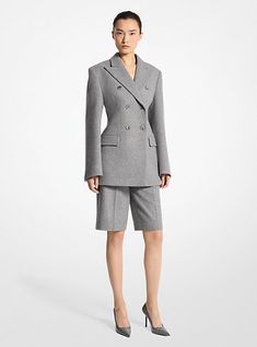 Suiting for today: exquisitely tailored in Italy from wool doeskin, this timeless blazer features a strong silhouette with a carved-out waist and structured shoulders, which are further accentuated by padding and a double-breasted closure. Take inspiration from the runway and team it with banker-hued pleated shorts and stilettos. Luxury Blazer With Structured Shoulders For Fall, Luxury Structured Suit For Fall, Luxury Structured Suits For Fall, Tailored Luxury Blazer Dress For Fall, Luxury Fall Blazer With Structured Shoulders, Luxury Tailored Blazer Dress For Fall, Luxury Structured Boning Blazer For Fall, Tailored Luxury Blazer Dress, Elegant Tailored Wool Blazer Dress