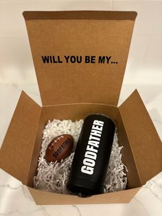 an open box with a football inside and the words, will you be my?