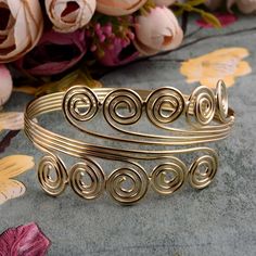 Gold Brass spiral adjustable cuff bracelet, handmade Brass bracelet Handmade  Material:- Brass ♥ Customer satisfaction is our biggest priority, please contact us with any questions/queries for future or existing orders, and we will do our best to make sure you are happy with your order. ♥ Please Make Sure to Include The Correct Address During Before Ordering. You Can return the Item within 30 Days After Successful Delivery. We offer a 100% Money Back Guarantee If You Are Not Satisfied With Your Purchase. Return Charge Will Be Paid By Buyer Only. ♥ If You Need Fast Shipping, please get in touch with us You can find more of the items in my shop here:- https://www.etsy.com/in-en/shop/jaipurjewelryIN Thank you for visiting my shop!             jaipurjewelryIn Handmade Spiral Bangle Gift, Handmade Spiral Bangle As Gift, Handmade Adjustable Swirl Jewelry, Adjustable Spiral Metal Bracelet, Handmade Adjustable Spiral Cuff Bracelet, Adjustable Metal Spiral Cuff Bracelet, Handmade Adjustable Spiral Bracelets, Handmade Adjustable Spiral Bracelet, Handmade Spiral Metal Bracelet