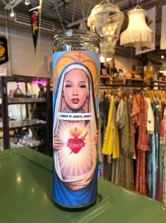 there is a glass with an image of the virgin mary on it in a store