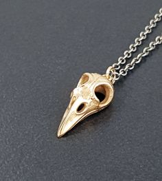 "A cast bronze bird skull hangs from an adjustable 16-18\" sterling silver chain. The entire piece has been oxidized to bring out the detail. The bird pendant measures approx 1\" long. This necklace is great for layering or for wearing by itself. To see more necklaces: http://www.etsy.com/shop/MicheleGradyDesigns?section_id=5565754 To return to my shop: http://www.MicheleGradyDesigns.etsy.com Michele Grady Designs Official Website: http://www.michelegrady.com Check out our other Etsy shops too! Bird Skull Jewelry, Crow Jewelry, Bird Skull Necklace, Skull Hanging, Raven Skull, Peridot Necklace, Bird Skull, Bird Pendant, Skull Jewelry