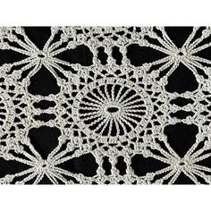 an image of a white doily on black background