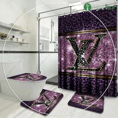 the bathroom is decorated in purple and black with a monogrammed v on it