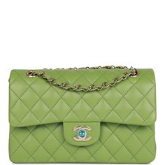 This Small Classic Double Flap bag is in Green caviar leather with light gold tone hardware and features a front flap with signature CC turnlock closure, half moon back pocket, and adjustable interwoven light gold tone chain link and green leather shoulder strap. The interior is lined in green leather with the "love letter" zipper compartment underneath the first flap, an "outer" slit pocket under the second flap, and an interior compartment with two open pockets separated by a "lipstick" compartment. Collection: 23C Origin: France Condition: Pristine, new or never (plastic on hardware) Accompanied by: Chanel box, Chanel dustbag, carebook, retail UPC and ribbon Measurements: 9" width x 5.25" height x 2.5" depth; 16.5" strap drop (9.5" doubled) Chanel Box, Handbag Wallet, Sierra Leone, Green Leather, Flap Bag, Half Moon, Small Bags, Wallet Case, Handbag Accessories