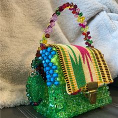 This Is A Beaded Bag With Fine Kente This Bag Is Home Made And It Takes 1 Day To Make One Bag This Bag Has Never Been Used So Please Help Support My Tiny Business It's Perfect If You Want Something To Make Your Outfit Pop. It's Also A Little Clear Sea Through Green Beaded Rectangular Bag, Green Square Beaded Bag, Green Square Bag For Fashion, Trendy Green Beaded Bag, Green Beaded Bags For Daily Use, Green Beaded Bag For Summer, Summer Green Beaded Bag, Yellow Beaded Rectangular Bag, Green Beaded Shoulder Bag For Beach