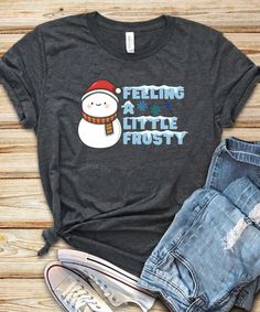 "All T-Shirt apparel are printed using direct-to-garment (also known as DTG). In addition, our inks are water based and eco-friendly. This makes the feel much softer than traditional screen printed shirts, but just as durable. Feeling a little frosty shirt, Snowman shirt, Snowman holiday shirt, Christmas shirt, Winter design, Unisex design, for men and women **All sales are final and we don't accept returns. If we made a mistake we will send a replacement.** The best way to get the size you need Winter Holiday Short Sleeve Shirt, Short Sleeve Holiday Shirt For Winter, Winter Graphic Tee With Relaxed Fit, Winter Relaxed Fit Graphic Tee, Winter Short Sleeve Tops With Letter Print, Short Sleeve Tops With Letter Print For Winter, Winter Crew Neck Pre-shrunk T-shirt, Pre-shrunk T-shirt As Winter Gift, Winter Relaxed Fit Screen Print T-shirt