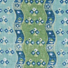 a green, blue and white pattern on fabric