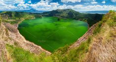 green lake in the middle of mountains