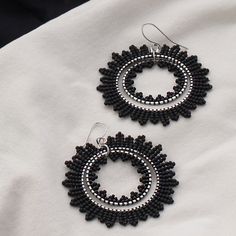 Eclipse Amazing handcrafted earrings, black (matte finish). Silver-plated details. - Colours: black - Length - 5.5сm (including earring silver-plated hook) - Width - 4.5сm - Total weight - 5.7 grams Please note that the actual colours may vary slightly from what you see on your screen due to monitor settings, which are beyond my control. Black Beaded Hoop Earrings For Party, Black Beaded Round Hoop Earrings, Nickel Free Black Round Bead Earrings, Black Beaded Round Earrings, Handmade Black Dangle Hoop Earrings, Nickel-free Black Beaded Dangle Earrings, Black Metal Round Beads Earrings, Black Metal Earrings With Round Beads, Nickel-free Black Beaded Drop Earrings