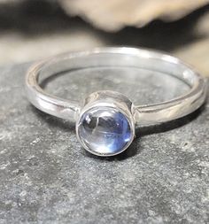 This is a sterling silver and kyanite ring. It is new vintage- never worn old store stock. The stone measures just under 1/4 of an inch around. This retailed at $42.  It comes in a tiny jewelry/gift box. Silver Crystal Gemstone Ring For Everyday, Everyday Silver Crystal Ring With Gemstone, Silver Crystal Ring With Gemstone For Everyday, Sapphire Moonstone Ring In Sterling Silver As Gift, Silver Everyday Birthstone Ring With Bezel Setting, Silver Birthstone Ring With Bezel Setting For Everyday, Everyday Silver Birthstone Ring With Bezel Setting, Sterling Silver Stackable Topaz Ring Gift, Silver Spiritual Stackable Birthstone Ring