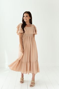 Features Sweetheart Neck Tiered sleeve dress 100% polyester Size + Fit True to size. Size Bust Length Small 34" 46" Medium 36" 46" Large 38" 46" X-Large 40" 46" Flowy Beige Chiffon Midi Dress, Beige Chiffon Maxi Dress With Ruffles, Flowy Casual Dress With Flutter Sleeves, Spring Flutter Sleeve Flowy Midi Dress, Flutter Sleeve Midi Dress With Smocked Back For Brunch, Feminine Flutter Sleeve Maxi Dress With Smocked Back, Flowy Beige Maxi Dress With Ruffle Hem, Spring Midi Dress With Ruffles And Butterfly Sleeves, Beige Flowy Maxi Dress With Ruffle Hem