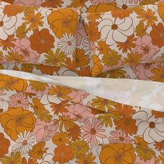 an orange and pink floral print sheet set