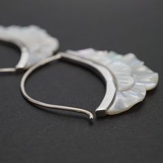 • Pair of Crescent Moon Hoops.• Hand-carved in mother-of-pearl.• Solid Sterling silver bezel and clasp.• 1.5" drop, 1.5" diameter hoop. Beautifully carved mother of pearl flowers set in a solid sterling bezel with standard gauge ear-wire for all standard pierced ears. Lightweight hand crafted flower hoop earrings. Perfect for every occasion, from everyday wear to a special night out. Our Mother of Pearl hoop earrings combine natural elegance with modern style. These boho-inspired hoops are perfe Flower Hoop Earrings, Best Life Ever, Pearl Flowers, Standard Gauge, Ear Gauges, Pearl Hoop Earrings, Moon Flower, Pierced Ears, Flower Crafts