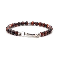 Handcrafted from 6mm Red Tiger's Eye, this bracelet features a Maya David silver bead and solid silver push clasp. An everyday piece that will add a touch of refinement to any look or stack. Sterling Silver Red Tiger's Eye 6mm Thickness Push Clasp Handcrafted in LA Red Tiger's Eye: Vitality, Protection, Emotional Balance, Stability Determining your bracelet size: Encircle your wrist with a flexible tape measure and record the measurement. Add 1/2 to 1 inch to your wrist measurement for a comfort Modern Gemstone Beads Bracelets, Classic Sterling Silver Bracelet With Polished Beads, Classic Bracelets With 8mm Beads For Everyday, Classic Polished Beads Bracelets For Everyday, Classic Everyday Bracelet With 8mm Beads, Classic Beaded Bracelets With Polished Beads For Everyday, Classic Everyday Bracelets With Polished Beads, Elegant Red Bracelets For Everyday, Elegant Red Casual Bracelets