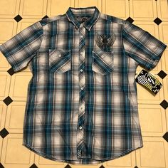 Nss Plaid Shirt Size Large New With Tags! Very Cool Skull And Wings Design On Chest Two Front Pockets Ships From A Smoke And Pet Free Home Reasonable Offers Welcome Blue Fitted Cotton Short Sleeve Shirt, Fitted Blue Cotton Short Sleeve Shirt, Blue Streetwear Shirt With Button Closure, Blue Button Closure Streetwear Shirt, Blue Button Closure Shirt For Streetwear, Casual Plaid Short Sleeve T-shirt, Casual Fitted Plaid Shirt, Casual Blue Cotton Short Sleeve Shirt, Casual Blue Short Sleeve Cotton Shirt