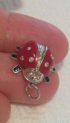 AUTHENTIC TIFFANY & CO. PLATINUM RED ENAMEL DIAMOND LADYBUG PENDANT NECKLACE  MATERIAL: Platinum THE PENANT WEIGHS: 7.5 grams (not including the cord) THE ENAMEL LADYBUG: Height/Length: 0.65", Width: 0.65" DIAMONDS: 18 round brilliant diamonds about .48TCW HALLMARKED: T & Co. PT950  CONDITION: Looks new recently serviced by store  I will include the new 18" black silk cord, the blue box. Silk Cord, Blue Box, Fine Jewellery Necklace, Black Silk, Cute Jewelry, Tiffany & Co., Round Brilliant, Charm Pendant, Jewelry Necklace Pendant