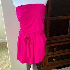 Beautiful Pink Color. Strapless With Tie Belt And Pockets. Stretchy Waistband And Stretchy Top. Summer Bandeau Stretch Jumpsuits And Rompers, Summer Stretch Bandeau Jumpsuits And Rompers, Summer Strapless Stretch Jumpsuit, Summer Stretch Strapless Jumpsuit, Stretch Strapless Jumpsuit For Beach, Bandeau Jumpsuits And Rompers For Spring Night Out, Spring Strapless Jumpsuit For Loungewear, Stretch Strapless Tube Top For Loungewear, Strapless Jumpsuits And Rompers For Summer Loungewear