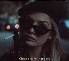 a woman wearing sunglasses and a hat with the caption chase dreams, not boys