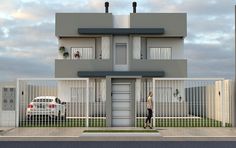 a white van parked in front of a two story house with balconies on the second floor