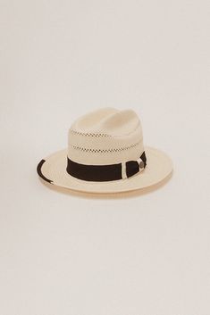 DESCRIPTION The Tremé features a mid size brim and cattleman crown. It's made of fine, handwoven paper straw. Delicate venting makes the hat a great summer option in the heat. The hat's distressed band is comprised of thick stacked, two-tone grosgrain ribbon and bow — topped off with a brass Two Roads crest pin. You'll also find a small piece of grosgrain edging on the front right corner. HAT SIZE CHART 55 57 59 61 63 Size S M L XL 2XL Inches 21 1/2" 22 1/4" 23 23 7/8" 24 5/8" Fitted Size 6 7/8 Curved Brim Straw Panama Hat For Kentucky Derby, Short Brim Toquilla Straw Hat For Country Events, Country Style Brimmed Panama Hat In Toquilla Straw, Fitted Toquilla Straw Panama Hat For Vacation, Natural Short Brim Panama Hat For Rodeo, Summer Toquilla Straw Hat Bands With Single Vent, Adjustable Toquilla Straw Fedora For Kentucky Derby, Fitted Straw Panama Hat For Rodeo, Classic Straw Panama Hat For Rodeo