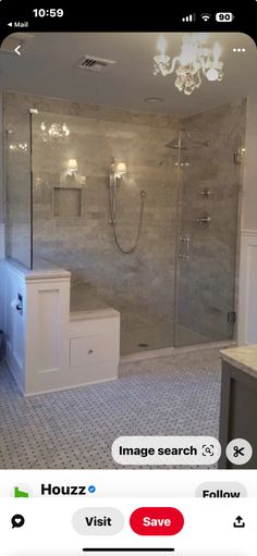 a bathroom with a large walk in shower next to a sink and toilet on the other side