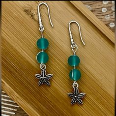 New Frosted Aqua Blue Bead Starfish Earrings With 925 Silver Ear Wire Hooks. Earrings Are 2 1/4 Inches Long. Nickel-free Star-shaped Ocean-inspired Jewelry, Silver Round Bead Earrings For Beach, Handmade Green Starfish Jewelry, Handmade Green Starfish-shaped Jewelry, Silver Ocean-inspired Earrings With Starfish Charm, Ocean-inspired Silver Earrings With Starfish Charm, Silver Star-shaped Beaded Earrings, Nickel-free Silver Beaded Earrings For Beach, Silver Drop Earrings With Starfish Charm