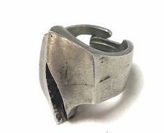 "For your consideration we offer this sculptural statement pewter ring from Norway. This ring is adjustable in size, from a 6 1/2 to a 11. Inside the band is marked \"Pewter\" and \"Norway\". The band is in good condition, it does show some wear revealing the age of this beautiful ring. This pewter ring is easy to adjust making it comfortable to wear. It would also make a great gift to a friend or family member if you are unsure of their ring size. This work of art is truly unique and would make Vintage Silver Hand Cast Ring, Vintage Hand Forged Metal Rings, Vintage Silver Rings With Hand Cast Design, Vintage Adjustable Metal Rings, Vintage Antique Silver Metal Rings, Strange Rings, Pewter Ring, Mid Century Jewelry, Beautiful Ring