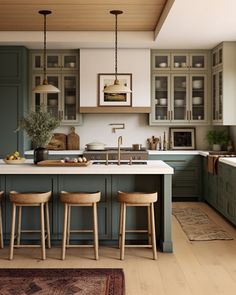 a kitchen with green cabinets and wooden stools