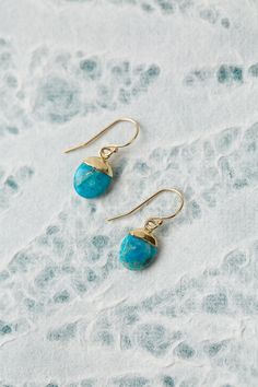 The Surrender Collection is soft and captivating. These simple turquoise earrings are finished with gold filled ear wires and are ideal for pairing with other items from the collection. Gold Filled (nickel and lead-safe) Turquoise 1", with gold filled ear wires We hand select our natural materials, thus there may be slight variations in color and/or size that will not detract from the overall aesthetic Our unique handcrafted designer jewelry for women is made in America, each design created indi Turquoise Earrings With Lever Back Ear Wires For Gifts, Turquoise Earrings With Lever Back Ear Wires As Gift, Blue Brass Jewelry With Ear Wire, Everyday Turquoise Brass Jewelry, Turquoise Dangle Jewelry With French Hook, Turquoise Jewelry With French Hook For Gift, Turquoise Brass Jewelry With Ear Wire, Turquoise 14k Gold-filled Earrings With Ear Wire, Turquoise 14k Gold Filled Earrings For Gift