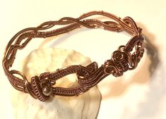 "Very intricate design wire woven bracelet , the hook and loop clasp can be worn on top of wrist or you can show the braided design on top instead ..either way looks nice.  Made with non tarnish antique copper wire.  Fits 7.5\"-8\" wrist.    Will be shipped in a small jewelry box for protection." Adjustable Brown Copper Braided Bracelets, Elegant Handmade Brown Braided Bracelets, Elegant Copper Wire Bangle Bracelets, Woven Bracelet Tutorial, Wrapped Bracelets, Celtic Knot Bracelet, Woven Bracelet, Wire Wrapped Bracelet, Purple Agate