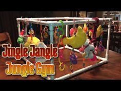 the jungle gym with toys hanging from it's sides and an image of stuffed animals on