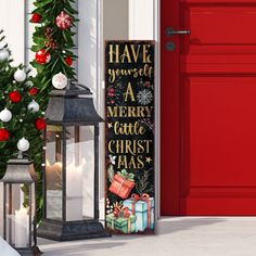 a christmas door sign next to a red door with holiday decorations and presents on it