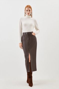 Allow this wardrobe staple to provide an instant update to everyday rotations. Crafted with premium leather, this midi skirt embraces an off-duty aesthetic, while corset-style seaming adds dimension to the piece. Belt loops and lapels add understated detailing this piece. Style this skirt with heels and a crop top to exude understated elegance at your next event.Midi hemlineLeatherFront leg slitZip fastening Midaxi Skirt, Maxi Pencil Skirt, Skirt Collection, Skirt Pencil, Midi Skirt Pencil, Faux Leather Skirt, Understated Elegance, Corset Style, Karen Millen