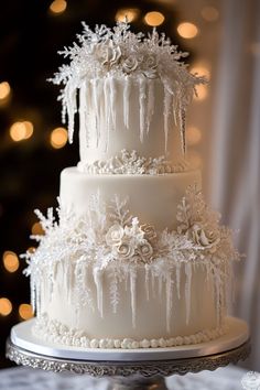 a white wedding cake with icing and flowers